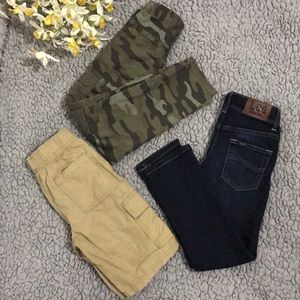 A bundle of 2 boys pants and a short sizes 7 & 8